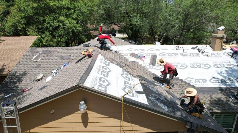 PL Roofing crew installing underlayment on a home in Humble, TX