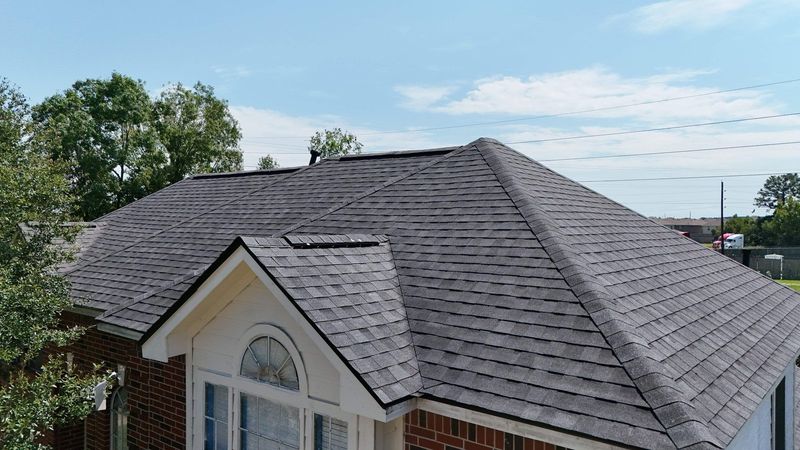 New dark shingle roof on a brick home in the Houston area