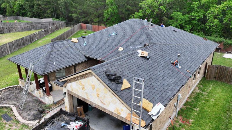 PL Roofing crew replacing the roof on a home in Porter, TX