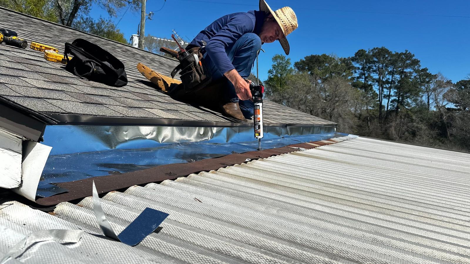 PL Roofing roofer sealing where a shingle roof meets a metal roof